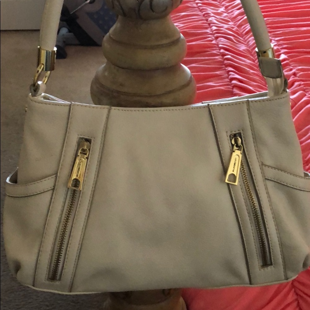 Liz Claiborne beige hand bag .